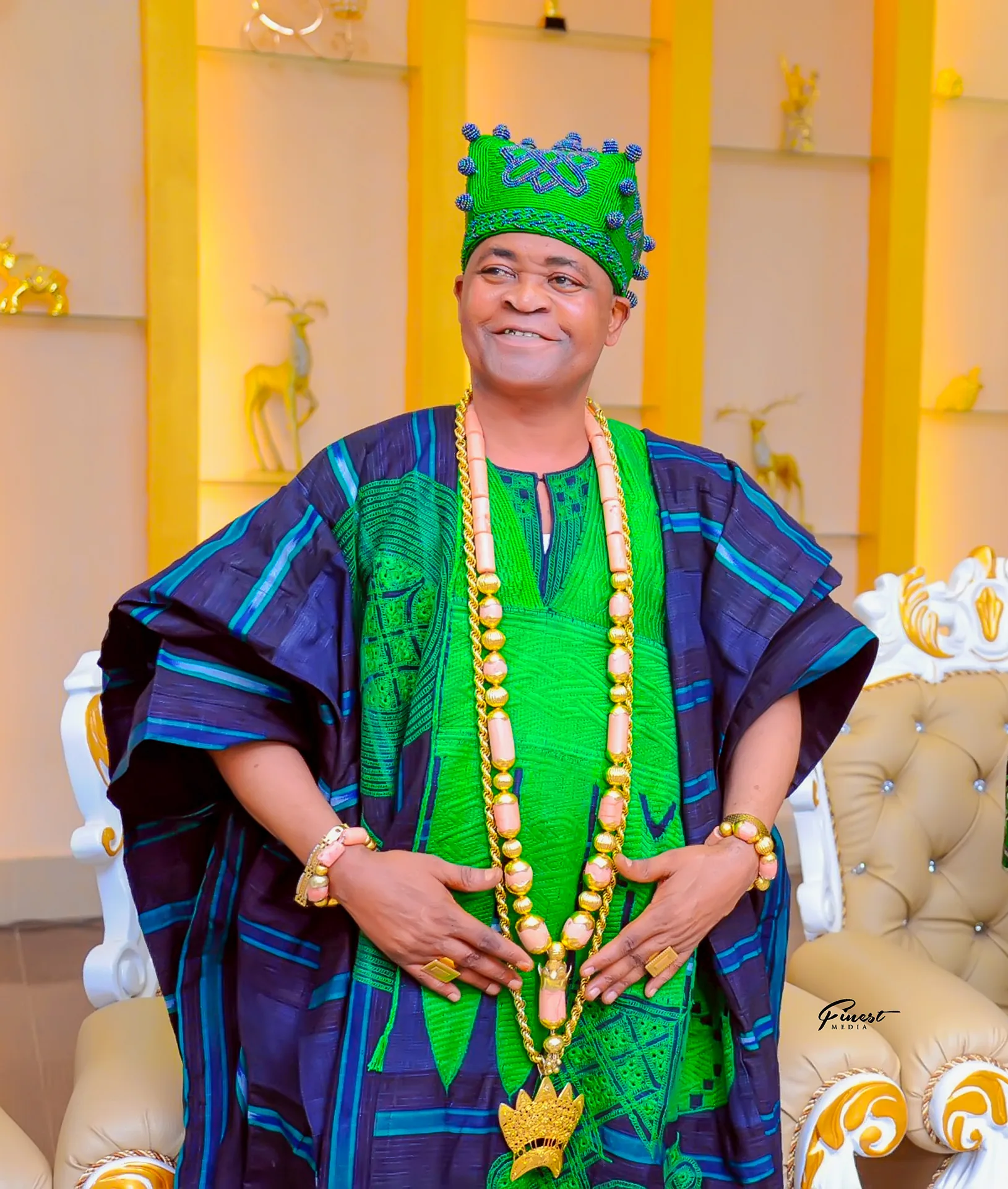His Royal Majesty Oba Abdulfatai Akorede Ayinde Akamo (Agbodere I) in royal green attire and crown