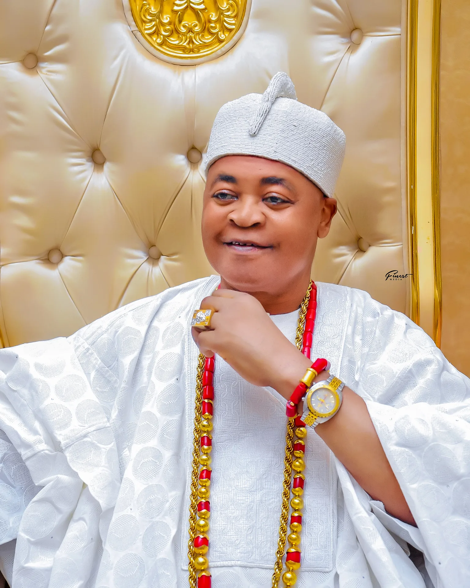 His Royal Majesty in silver white attire and crown